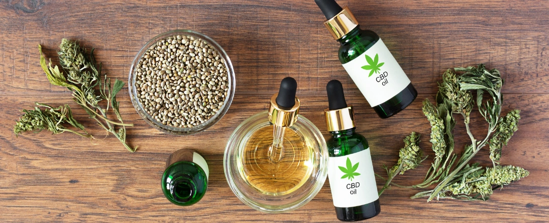 Image of CBD oil bottles and hemp products illustrating potential contamination risks for military drug testing