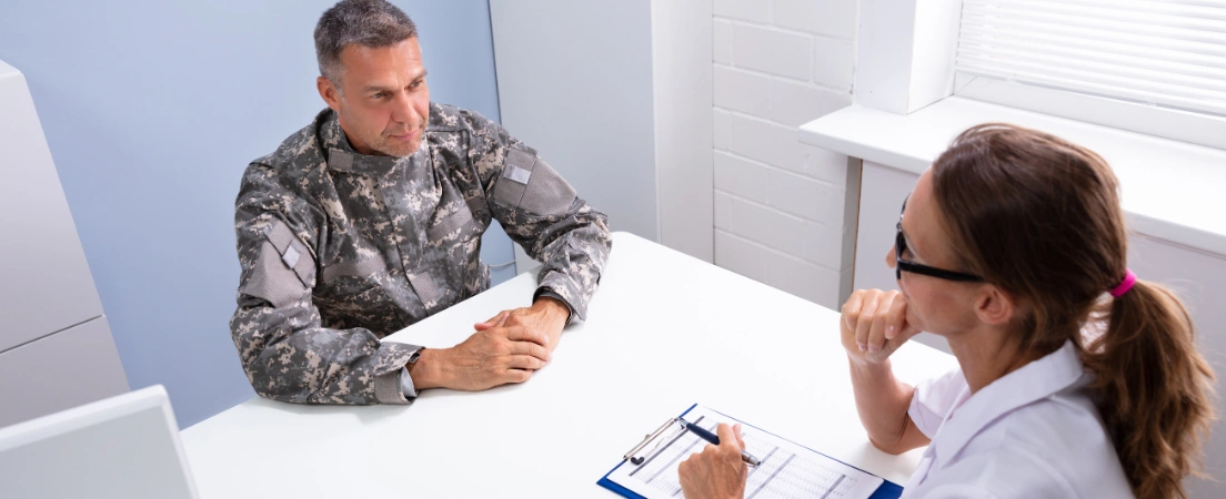 Image of a National Guard service member meeting with a healthcare provider about substance abuse treatment